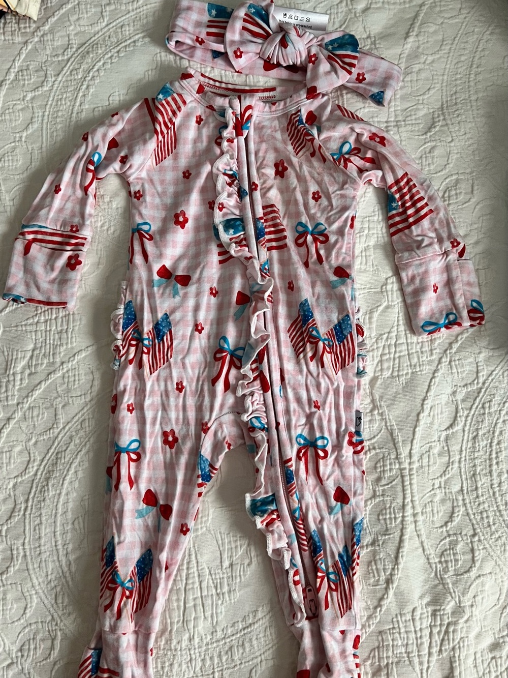Dream Big Little Co. Pink gingham Ruffle Zip One-Piece with Flag & Bow Print